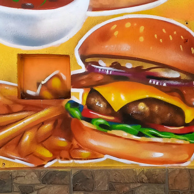 Mural de graffiti en Puebla - comida, rotulos